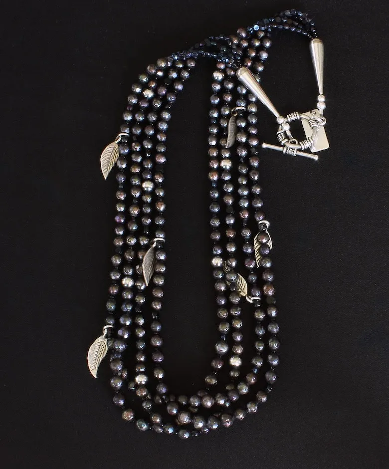 Black Faceted Pearl 4-Strand Necklace with Vintage Czechoslovakian Nailheads, Sterling Silver Leaf Charms, and Oxidized Sterling Silver Rounds