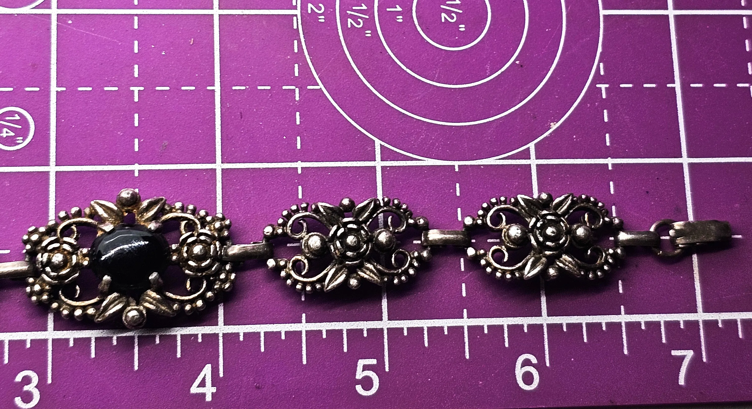 Filigree open work floral vintage panel bracelet with black stone accent