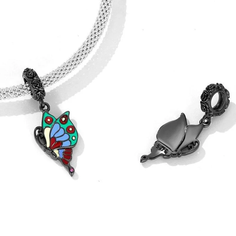 Vintage Black Rose Pistol & Butterfly Charm