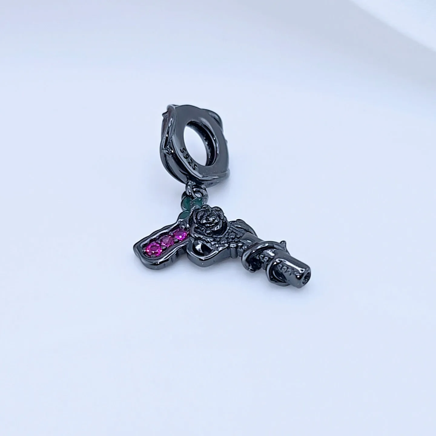 Vintage Black Rose Pistol & Butterfly Charm