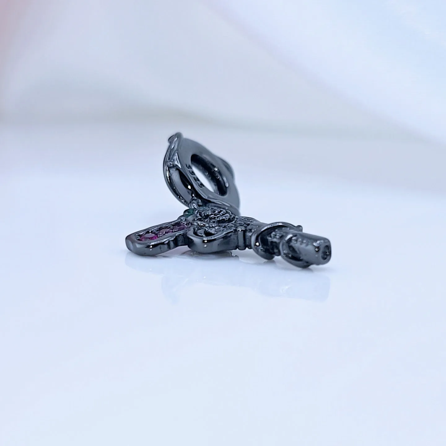 Vintage Black Rose Pistol & Butterfly Charm