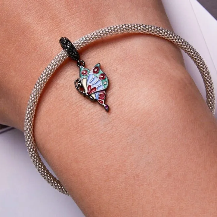 Vintage Black Rose Pistol & Butterfly Charm