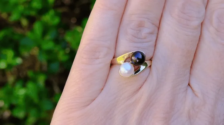 Yin and Yang Black and White Pearl Bypass Ring in Yellow Gold